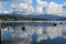 Reflection of the sky and clouds on the calm water of Lake Whatcom in fall
