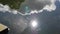 Reflection of sky, clouds and trees in water in a pond