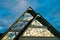 Reflection of a sky in a triangle glass shape on a building at Bled