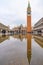 The reflection of St Mark`s Basilica and Campanile at St Mark`s Square Piazza San Marco, Venice, Italy