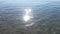 Reflection of the sun in the waves of the Mediterranean Sea at Lara Beach in Antalya Turkey