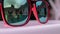 Reflection in sunglasses of teenagers girl enjoy in hotel swiming pool in vacation. two sisters playing, swimming and