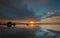 Reflection Sunrise on the beach in Sumner, Christchurch, NZ