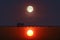 Reflection of sunset  silhouette bridge and pavillion in sea and full moon on sky