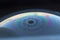 The reflection on the surface of a soap bubble looks like a planet.