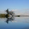 Reflection in swimming pool lake Manyara