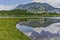 Reflection of Todorka peak in Muratovo lake, Pirin Mountain