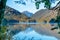 Reflection view in a lake with autumn forest and mountains in the Alps in the morning