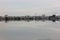 Reflection of the view of the residents` houses from the lake in the Pluit reservoir