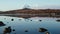 Reflection in the water. Snowy mountains, fishing village, red rorbu houses, and their peaceful reflections on the water