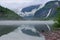 Reflections of Asafossen waterffall in Eide Lake