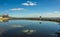 Reflections in the beach lagoon with the longest pleasure pier in the world in the background at Southend-on-Sea, UK