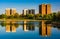 Reflections of buildings in Druid Lake, at Druid Hill Park, in B