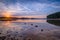 Reflections in a calm lake at sunrise