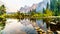 Reflections of Cathedral Rocks, Taft Point and Sentinel Dome in the Merced River in the smoke filled Yosemite Valley