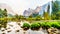 Reflections of Cathedral Rocks, Taft Point and Sentinel Dome in the Merced River in the smoke filled Yosemite Valley