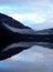 Reflections of clouds and sky on Cameron Lake, British Columbia