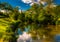 Reflections of clouds and trees in Antietam Creek, at Antietam National Battlefield