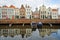 Reflections of colorful facades along Dam street in Middelburg, Zeeland