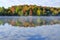 Reflections of Fall Colors on a Tranquil Lake