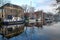 Reflections of historic houses and boats along Nieuwe Haven street, Edam