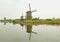 Reflections of the Historic Windmills Group at Kinderdijk, Molenwaard, Netherlands