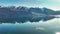 Reflections on lake Wakatipu from its surrounding mountain ranges