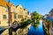 Reflections of medieval houses houses in the waters of a canal in Bruges, Belgium