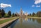 Reflections of Moscow State University main building in fountain cascade pool in sunny summer day