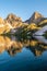 Reflections of mountain peaks on Tobavarchkhili lake, Egrisi mountains, Svaneti, Georgia