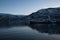 Reflections of the mountains in the ice cold water of a fjord around TromsÃ¸