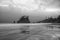 Reflections of sea stacks on the shore of a Pacific Northwest beach in Olympic National Park