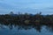 Reflections of shore on lake on a blue day!