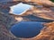 Reflections in Small sandstone Rockpools