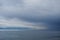 Reflections of storm clouds on a wavy but calm Juan De Fuca Strait near Victoria, BC