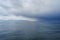 Reflections of storm clouds on a wavy but calm Juan De Fuca Strait near Victoria, BC