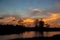 Reflections of sunset silhouette in the cypress swamp