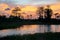 Reflections of sunset silhouette in the cypress swamp