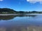 Reflections on surface of 90 Mile Beach, Ahipara, New Zealand