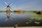 Reflections of a Windmill in Kinderdijk Unesco World Heritage, Netherlands