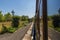 Reflections in the windows of the carriages of the Bluebell railway as the train passes through a station in Sussex, UK