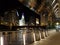 Reflective Chicago Riverwalk underpasses at night.