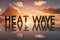 Reflective surface displaying bold HEAT WAVE letters amidst vibrant sunset or sunrise scene