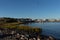 reflective waters with pretty blue sky by the shore