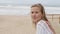 Reflective woman at the beach