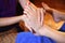 Reflexology foot massage, spa foot treatment by wood stick
