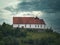 Reformed church Staufberg in Staufen under a dramatic sky.