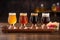 A refreshing beer flight presented on a wooden paddle, featuring small glasses of different brews, allowing enthusiasts to explore