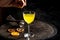 Refreshing citrus and alcoholic cocktail on dark background