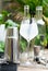 Refreshing cocktail with ice in glass goblet on wooden table